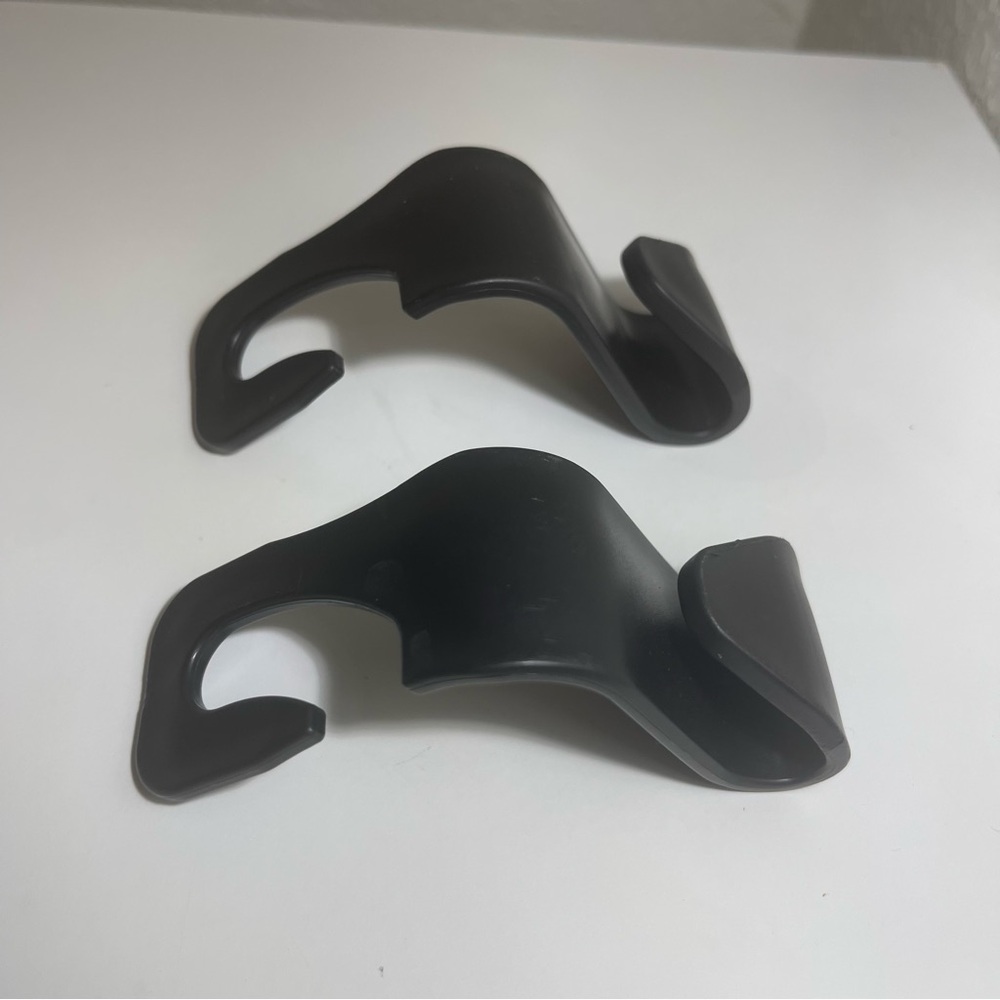 Two Black Car Seat Headrest Hooks